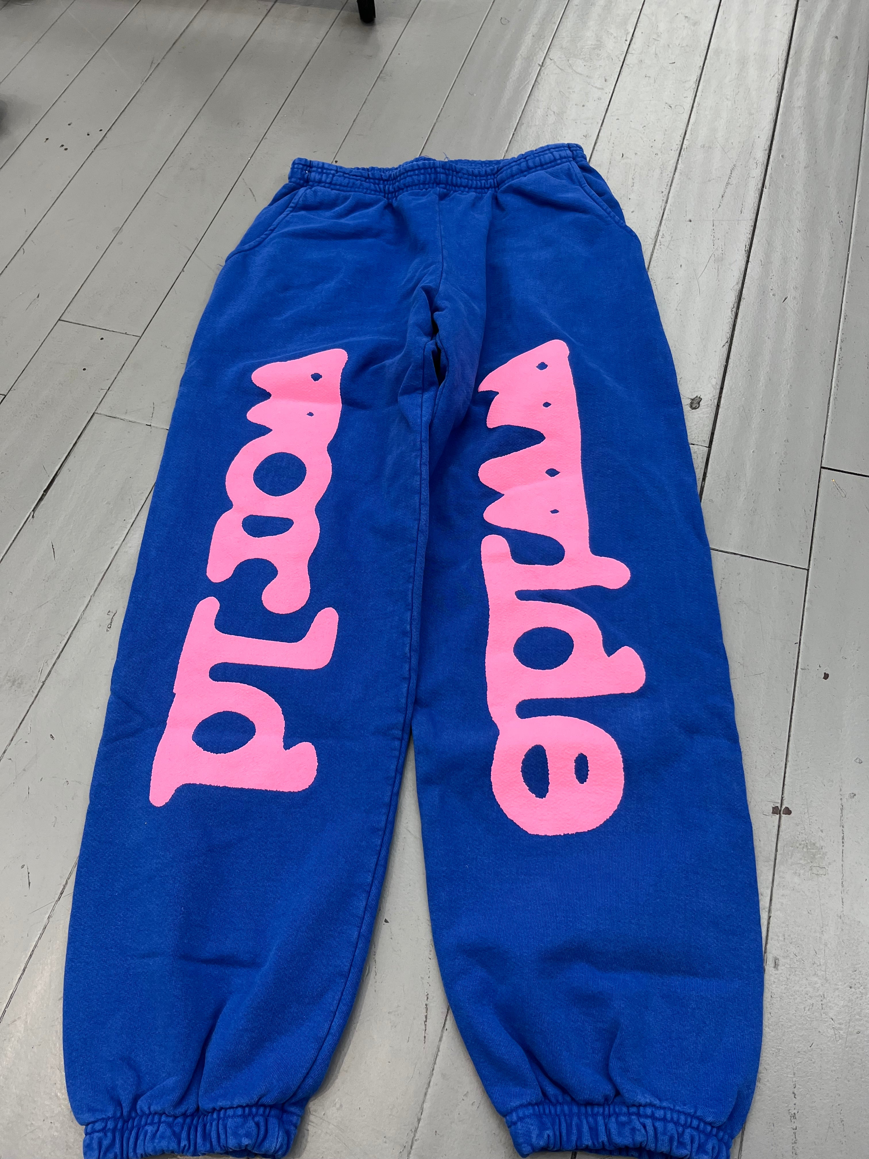 Spider sweatpants blue / pink logo