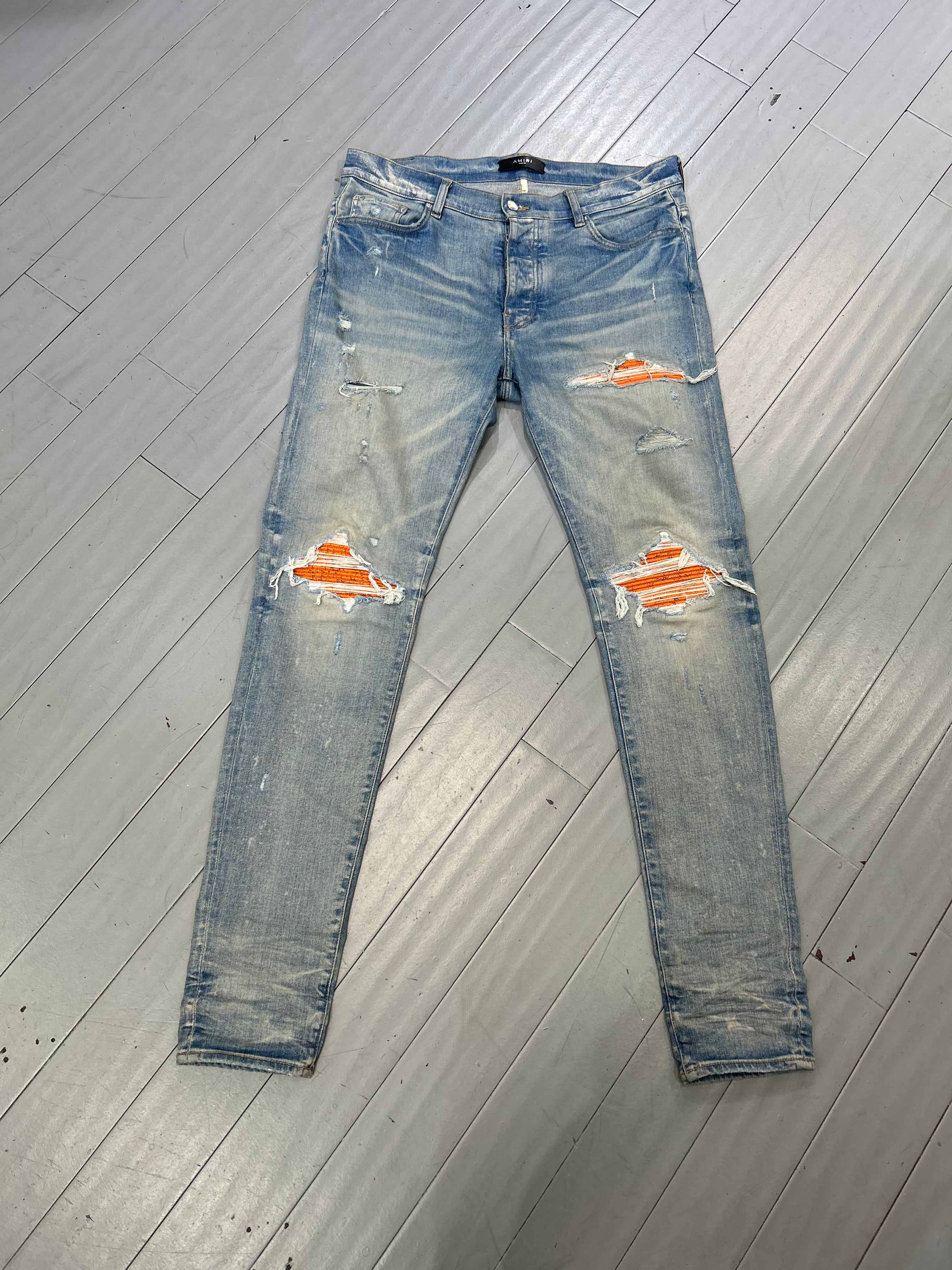 Amiri MX1 jeans light blue/ cracked orange